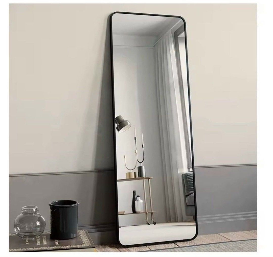 Modern Full Length Mirror with Black Frame (Category: Mirrors) located in Singapore. Submitted by min257 (Listing ID 1440341292, Image 1). Description: Width: 69 cm Length: 168 cm - Sleek black frame with modern rounded corners - Tall floor mirror, perfect for outfit checks - Leans against the wall, no installation required - Still in good condition with no major scratches Collect at my place near beauty world mrt.