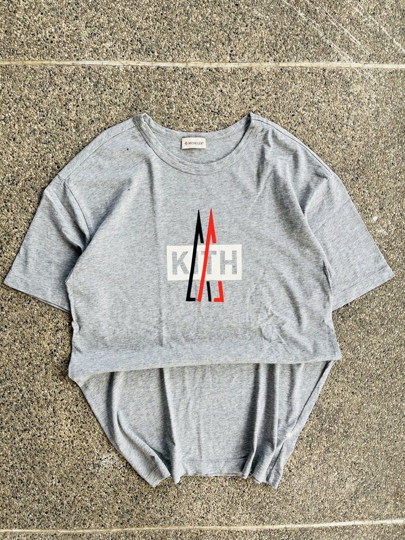 Moncler x Kith Grey T-shirt (Category: Tshirts & Polo Shirts ) located in Manila. Submitted by jaspermack50866 (Listing ID 1440207764, Image 1). Description: - Grey t-shirt - Moncler logo on collar - Kith graphic print on front - Comfortable for casual wear - Crew neck - Short sleeves.