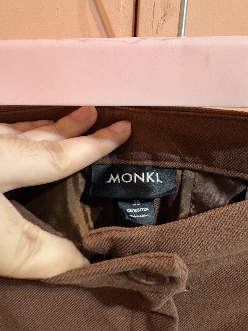 Monki Wide Leg Trousers Size 38 (Category: Other Bottoms) located in Bulacan. Submitted by smdjc (Listing ID 1440205741, Image 2). Description: - Monki High-Waisted Wide Leg Trousers - Color: Brown - Closure: Button and Zip - Pockets: Two front pockets - Style: Versatile for casual or formal wear - Feel: Chic and comfortable.