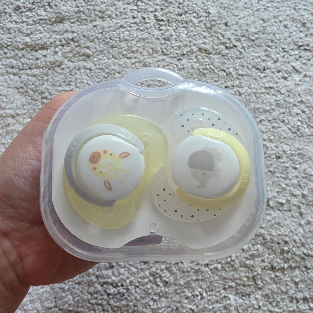 Mothercare Pacifier Set with Case Giraffe Elephant Design (Category: Soothers & Pacifiers) located in Mandaluyong City. Submitted by beaorselena (Listing ID 1440352008, Image 1). Description: - Set of 2 pacifiers - Adorable giraffe and elephant designs - Yellow and grey color scheme - Includes a convenient travel case - Ideal for babies.