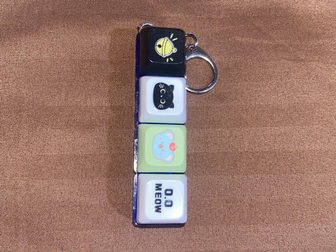 MR DIY Malaysia Fidget Toy (Category: Character Goods) located in Manila. Submitted by dianaclutz (Listing ID 1440237543, Image 2). Description: - MR DIY Malaysia Fidget Toy Keychain - Features stacked cubes with fun designs (bell, cat, character, 'meow') - Ideal for sensory play and stress relief - Attaches easily to bags or keys -Good as new.