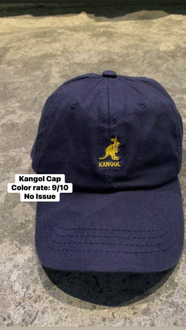 Navy Kangol Cap with Yellow Kangaroo Logo (Category: Caps & Hats) located in Manila. Submitted by thrift2mnla (Listing ID 1440350364, Image 1). Description: - Classic navy blue Kangol cap - Iconic yellow kangaroo logo embroidered on front - Adjustable leather strap with metal buckle.