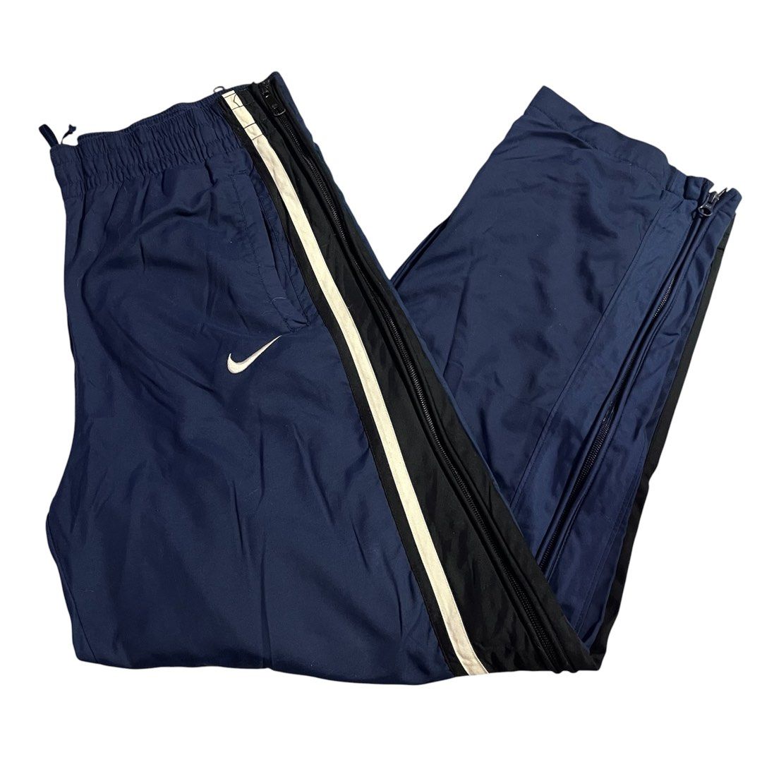 NIKE Y2K TRACK PANTS FULL SIDE ZIP (Category: Joggers) located in Manila. Submitted by gotstar (Listing ID 1440250007, Image 1). Description: NIKE Y2K NAVY PANTS FULL ZIP SIDE ~ Dimensions• Width: 34 Length: 39 Leg Opening: 9 ~ Good Condition 9/10 Overall Condition ~ ₱999 ~ Price does not include shipping fee Check details before buying Color may vary due to lightning.