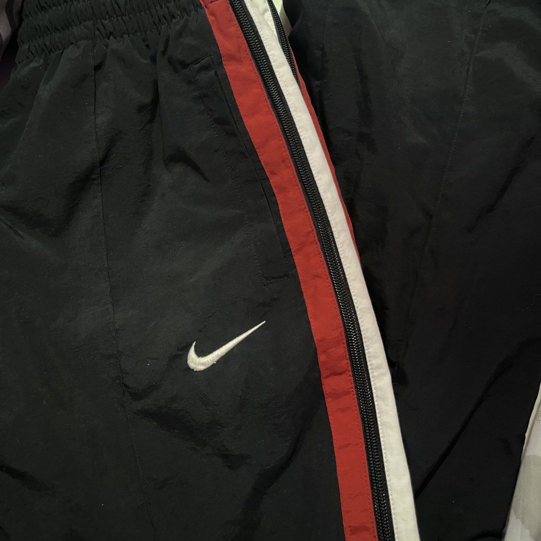 NIKE Y2K TRACK PANTS FULL SIDE ZIP (Category: Joggers) located in Manila. Submitted by gotstar (Listing ID 1440250790, Image 2). Description: NIKE Y2K TRACKPANTS BLACK RED ~ Dimensions• Width: 28-36 Length: 39 Leg Opening: 9.5 ~ 9/10 Overall Condition ~ ₱1000 ~ Price does not include shipping fee Check details before buying Color may vary due to lightning.