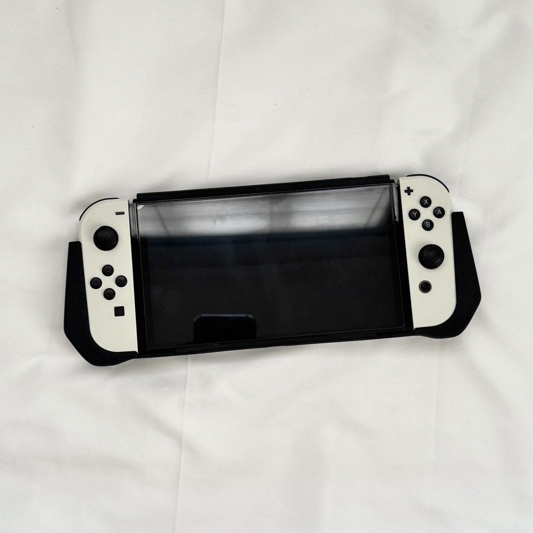 Nintendo Switch Accessories (pouch, silicone & acrylic case, cartridge holder, joycon controller case) (Category: Nintendo) located in Taytay. Submitted by fulllsun (Listing ID 1440283792, Image 2). Description: SET PRICE: ₱300 INDIVIDUAL PRICE: pouch: X silicone grip case + acrylic joycon cases: ₱230 cartridge holder: ₱50 2 joycon grip cases: ₱100 *console and joycon strap not included mop: gcash gotyme maribank mod: j&t ggx or sdd .