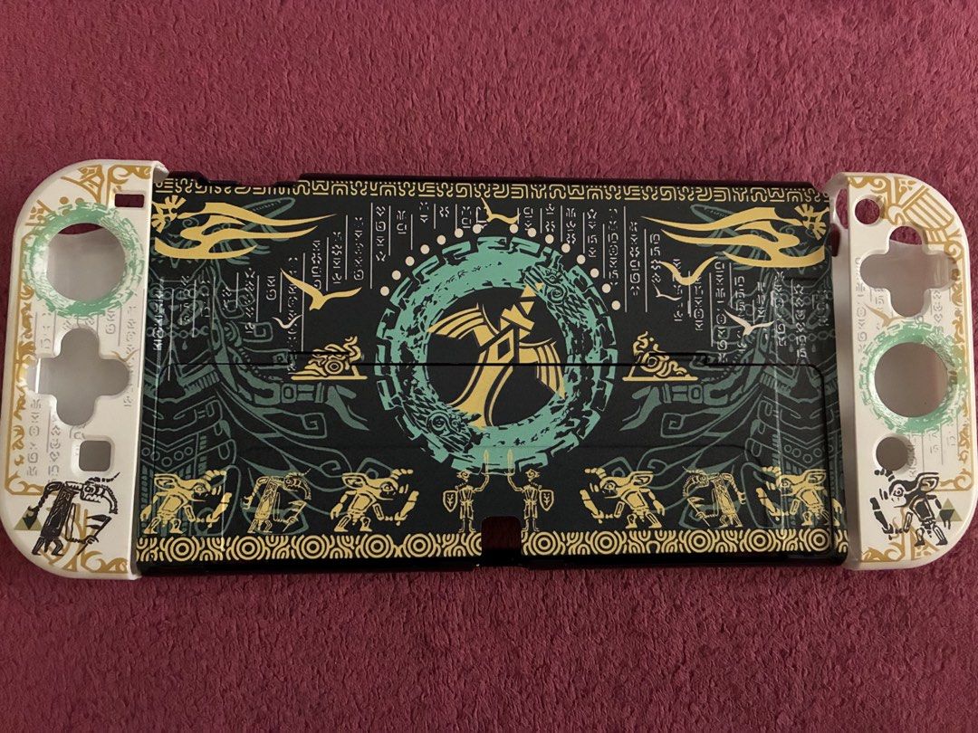 Nintendo Switch OLED Zelda theme Protective Case (Category: Cases & Covers) located in Manila. Submitted by akiimii (Listing ID 1440255468, Image 1). Description: Switch OLED protective hard shell case. Dockable rfs: ordered 2 cases, ended up not liking the design. Never used other than testing it for design but inalis agad. (red controllers ko instead of white so di ko trip haha) slim enough na pwede parin ma dock without removing it if thats a 