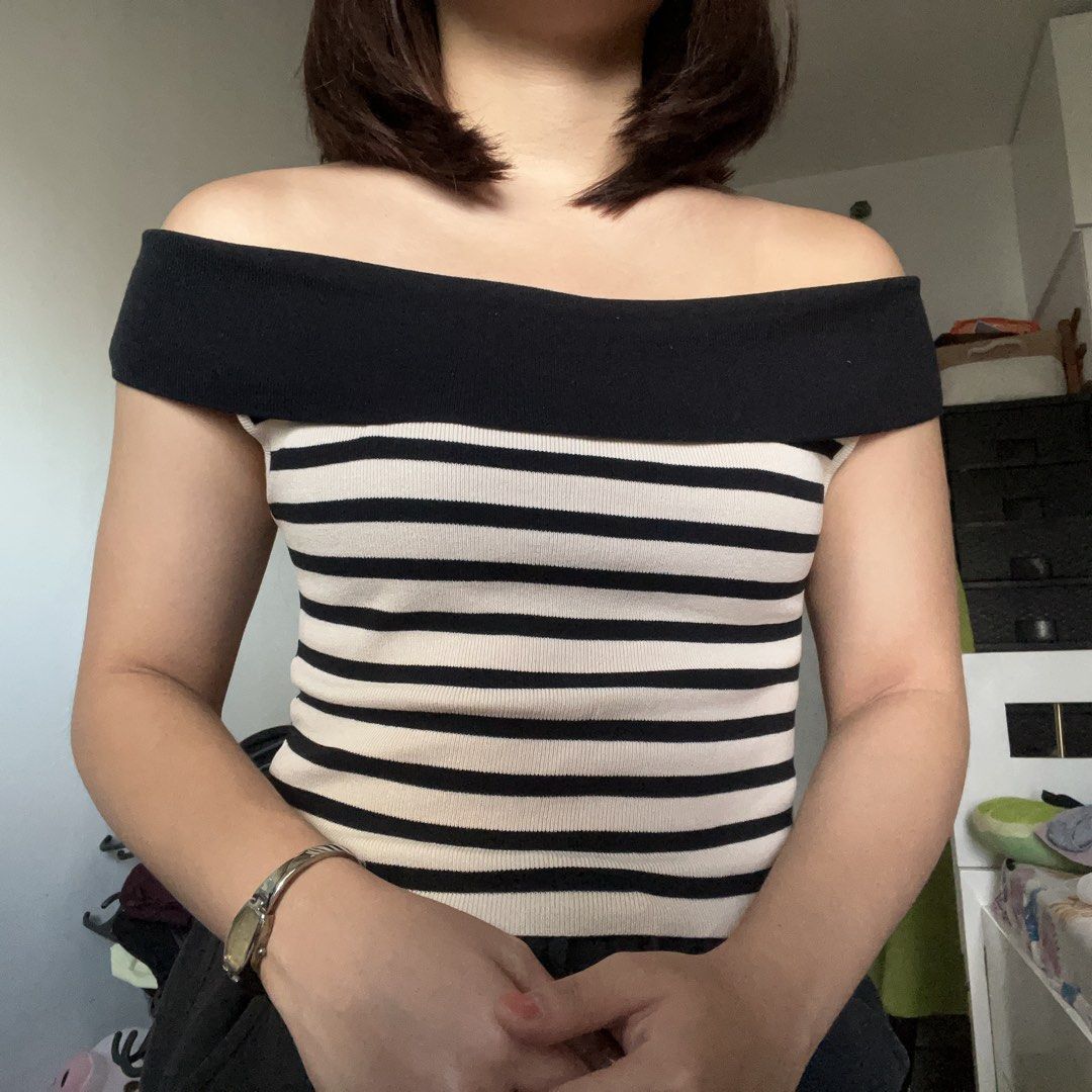 Off-Shoulder Striped Knit Top (Category: Blouses) located in San Juan City. Submitted by 1104basics (Listing ID 1440317536, Image 3). Description: - Black and cream striped knit top - Stylish off-shoulder design - Stretchy and comfortable material - Flattering fit for any occasion - Versatile for casual outings or dressing up Freesize Model is size small to med for reference .