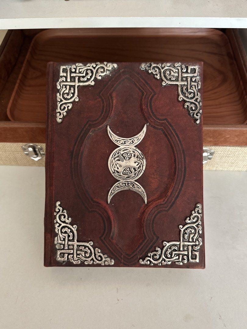 OLD Triple Goddess Embossed Leather Journal - Old World Style Notebook (Category: Storybooks) located in Mexico. Submitted by amidalajewelryandartifacts (Listing ID 1440261932, Image 2). Description: Product Description: Old Handcrafted Leather Journal / Notebook with Triple Goddess Emblem Beautifully crafted, old-world style leather journal featuring a striking central metal emblem of the Triple Goddess (Triple Moon) with intricate Celtic knotwo