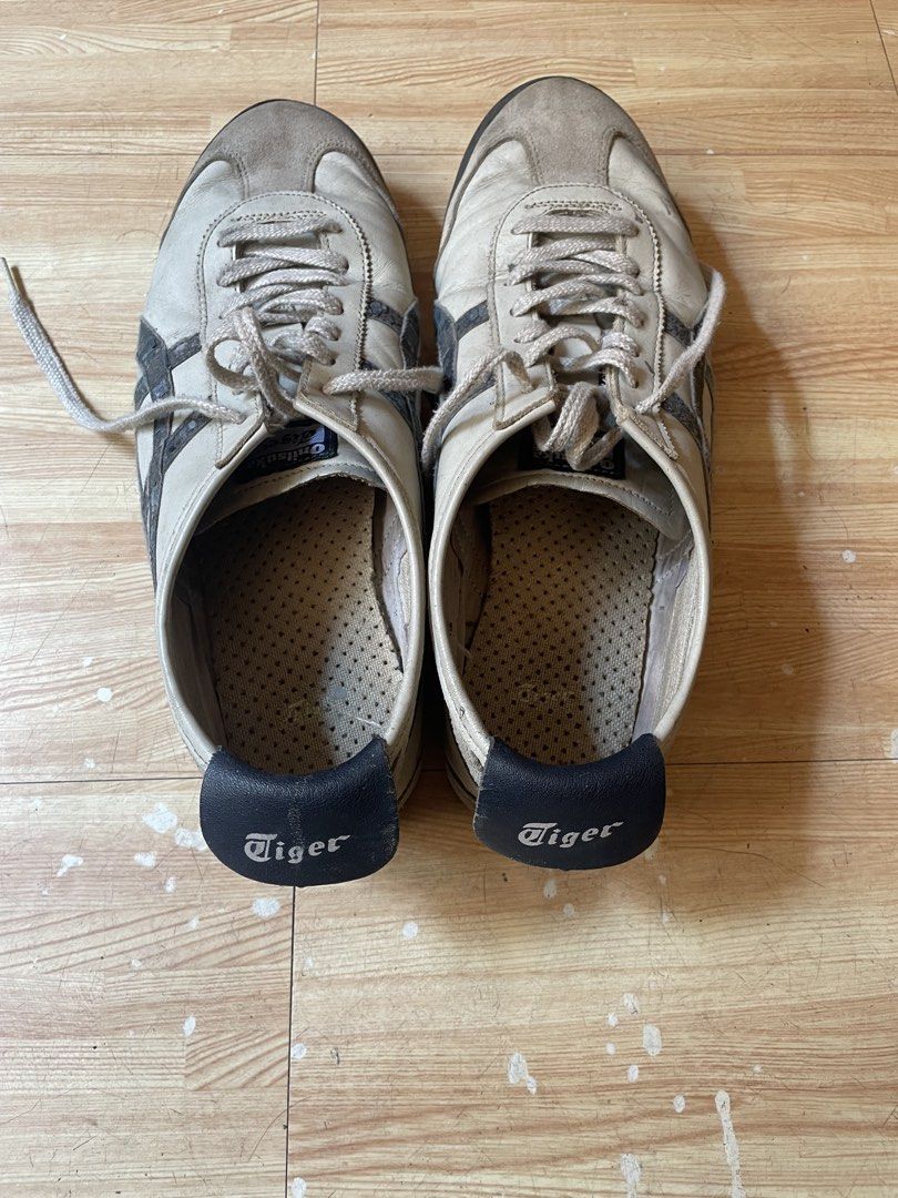 Onitsuka Tiger Mexico 66 Sneakers (Category: Sneakers) located in Caloocan City. Submitted by jetcon (Listing ID 1440259848, Image 2). Description: - Classic Onitsuka Tiger Mexico 66 sneakers - Color: Light beige and grey with black stripes - Condition: Used, with visible wear on soles and uppers - Plenty of life left for casual wear.