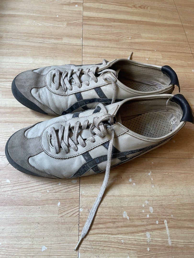 Onitsuka Tiger Mexico 66 Sneakers (Category: Sneakers) located in Caloocan City. Submitted by jetcon (Listing ID 1440259848, Image 3). Description: - Classic Onitsuka Tiger Mexico 66 sneakers - Color: Light beige and grey with black stripes - Condition: Used, with visible wear on soles and uppers - Plenty of life left for casual wear.
