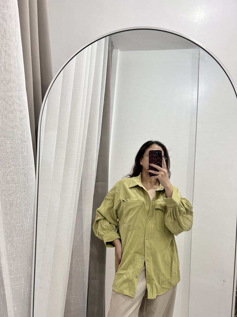 Oversized Green Button-Up Shirt with Puffy Sleeves (Category: Shirts) located in Caloocan City. Submitted by avryph (Listing ID 1440366304, Image 1). Description: - Oversized green shirt - Button-up style - Two chest pockets - Puffy sleeves with button cuffs - Relaxed fit - Ideal for casual wear - Easy to style MOP: Gcash/BPI Thru J&T Express .