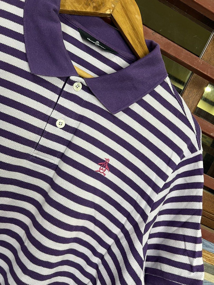 Penguin Munsingwear Polo Shirt (Category: Tshirts & Polo Shirts ) located in Iba. Submitted by saploot (Listing ID 1440361416, Image 2). Description: - Munsingwear Polo Shirt - 22x28 - Color: Purple and White Stripes - Sleeve Length: Short Sleeves - Closure: Button-up Front - Features: Embroidered Munsingwear Penguin Logo on Chest - Origin: Made in Japan - Style: Casual Wear.