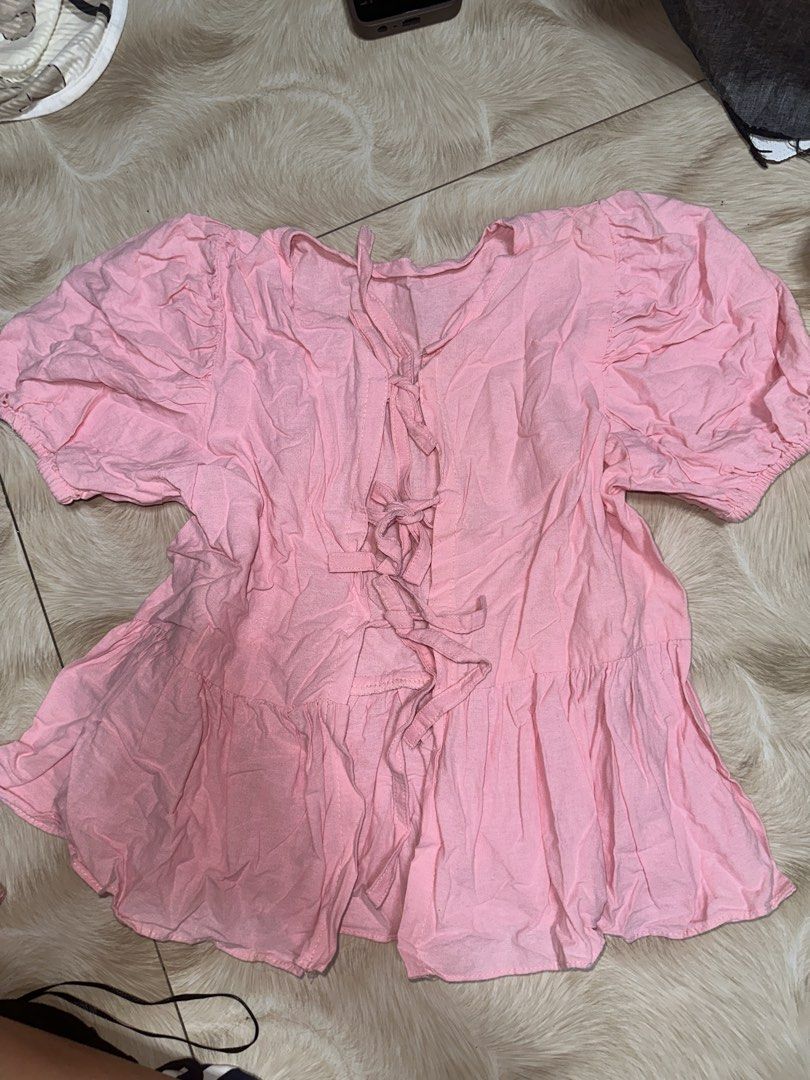 Pink Puff Sleeve Tie Front Peplum Top (Category: Blouses) located in Manila. Submitted by abegailla22409 (Listing ID 1440363373, Image 2). Description: - Adorable pink top - Features stylish puff sleeves - Flattering tie-front design - Chic peplum hem - Made from lightweight, slightly crinkled fabric - Versatile for casual outings or dressing up.