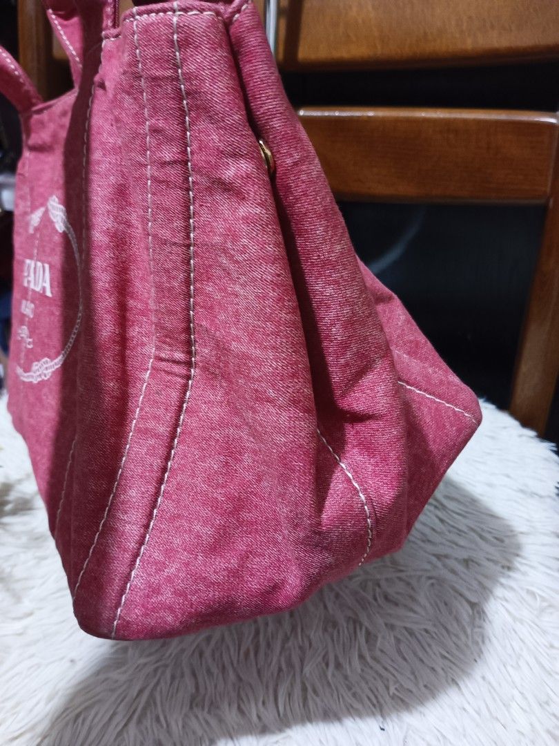 Prada Canvas Tote Bag Pink (Category: Luxury Bags & Wallets) located in Digos. Submitted by chihanu (Listing ID 1440336472, Image 3). Description: - Pink Prada Canvas Tote Bag - Features the classic Prada logo prominently on the front - Equipped with sturdy handles for comfortable carrying - Secure snap closure on the sides - Ideal for everyday use, offering ample space for your essentials.