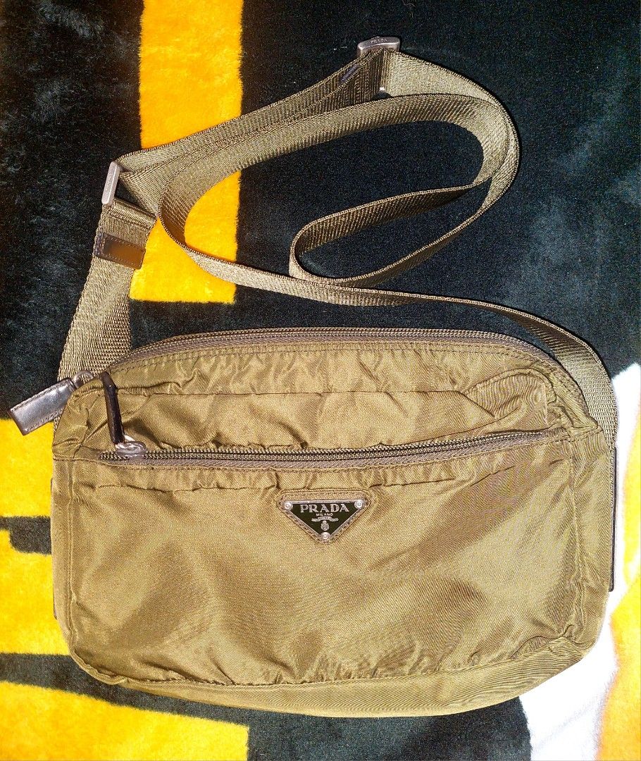 Prada Nylon Crossbody Bag Khaki (Category: Luxury Bags & Wallets) located in Puerto Princesa. Submitted by YeSurJOMS (Listing ID 1440336679, Image 1). Description: - Authentic Prada crossbody bag - Khaki nylon material - Adjustable strap - Front zip pocket - Main zip compartment - Great for everyday use.
