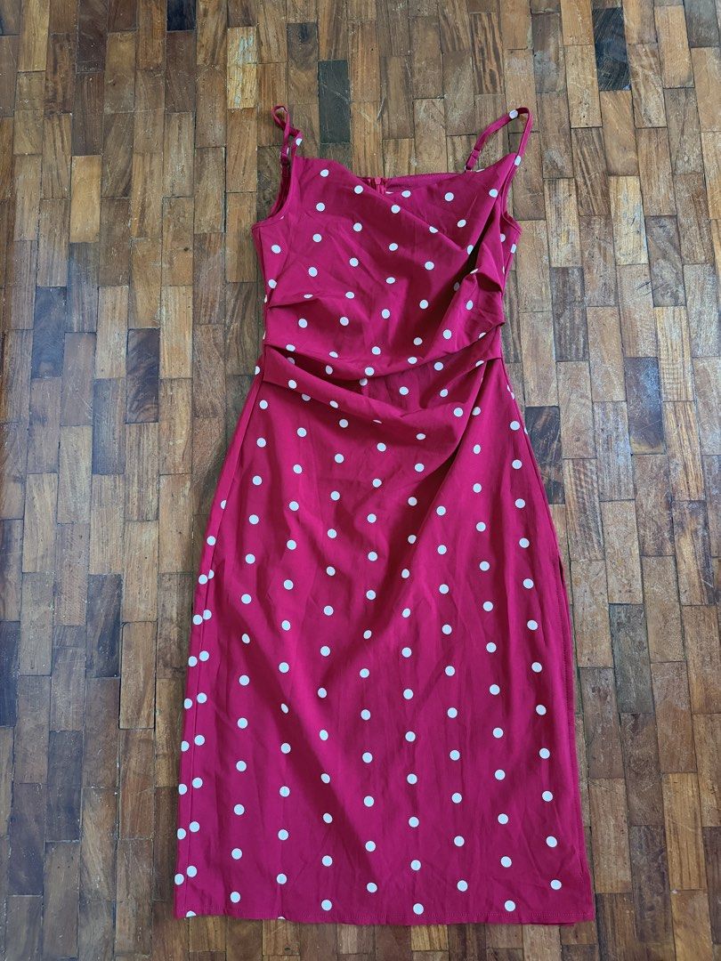 Red Polka Dot Midi Dress with Spaghetti Straps (Category: Dresses) located in Quezon City. Submitted by lovedbycnm (Listing ID 1440336201, Image 1). Description: - Cute red midi dress with white polka dots - Features spaghetti straps - Ruched detail on the side - Lightweight and flowy fabric - Side slit for easy movement - Perfect for casual outings or dressing up.