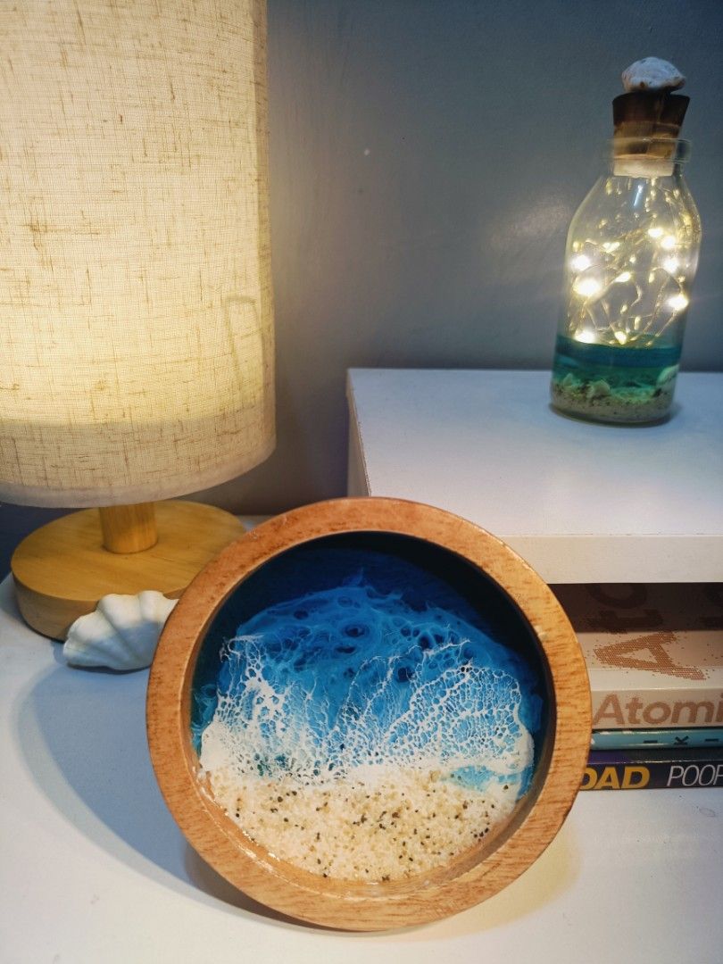 Resin Ocean Wave WoodenCoaster (Category: Other Home Decor) located in Calumpit. Submitted by ells25 (Listing ID 1440293892, Image 3). Description: - Beautiful handmade resin coaster - Realistic ocean wave design with sandy beach and clear blue water - Natural wooden rim - Protects surfaces from drinks - Can also be used as a trinket dish for keys or jewelry - Unique piece for home decor.