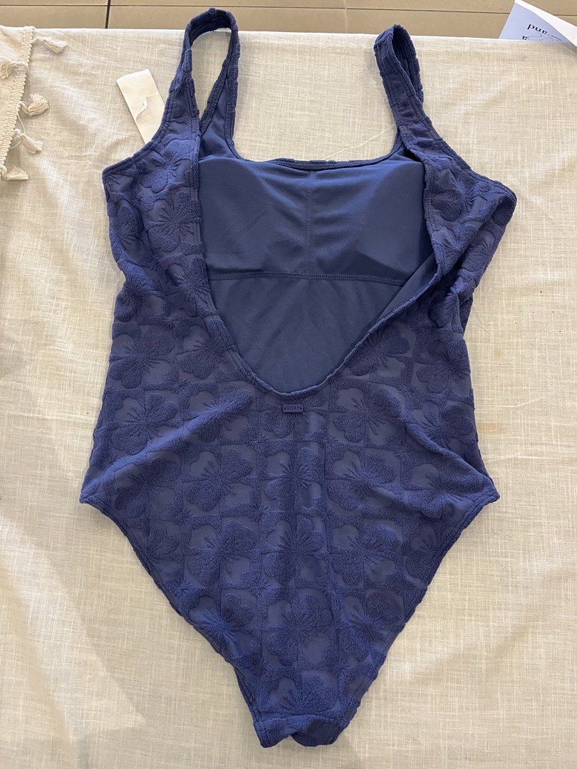Roxy Blue Textured Floral One-Piece Swimsuit (Category: Bikinis & Swimsuits) located in Manila. Submitted by nyosh2026 (Listing ID 1440326480, Image 2). Description: - Roxy one-piece swimsuit - Size L / G / AUS 12 - Textured blue fabric - Pretty all-over floral pattern - Flattering scoop neckline - Stylish low back design - Comfortable for beach days and pool lounging.