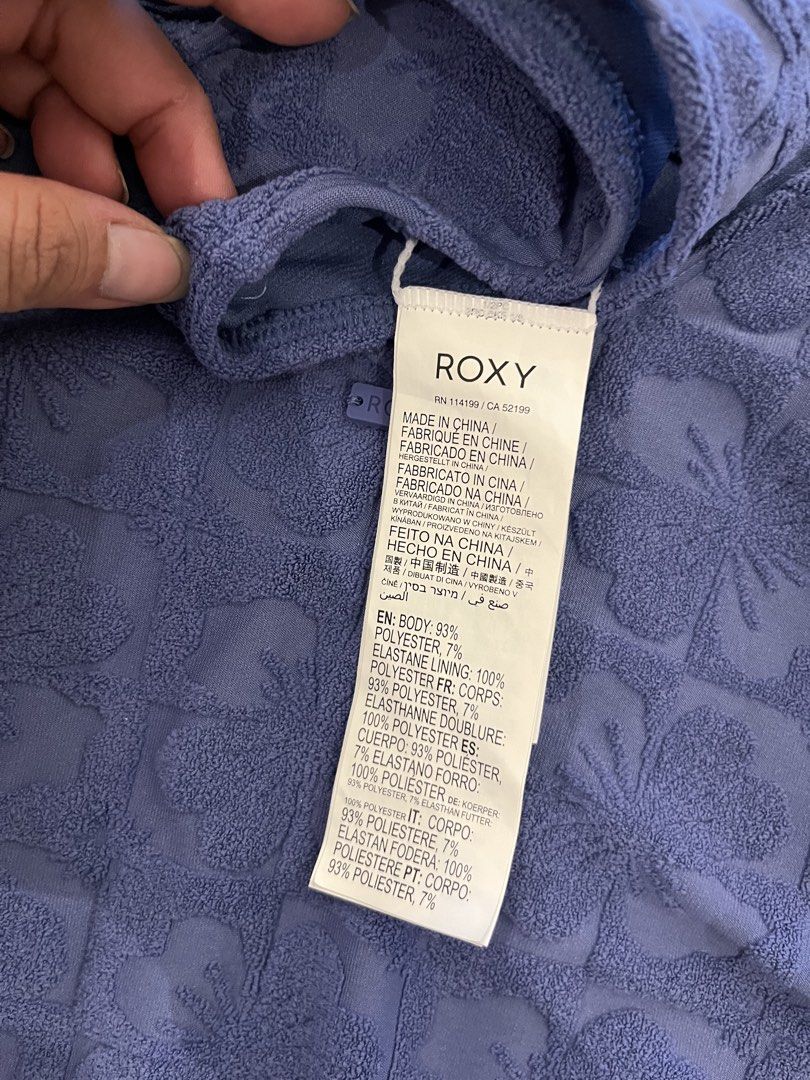 Roxy Blue Textured Floral One-Piece Swimsuit (Category: Bikinis & Swimsuits) located in Manila. Submitted by nyosh2026 (Listing ID 1440326480, Image 3). Description: - Roxy one-piece swimsuit - Size L / G / AUS 12 - Textured blue fabric - Pretty all-over floral pattern - Flattering scoop neckline - Stylish low back design - Comfortable for beach days and pool lounging.