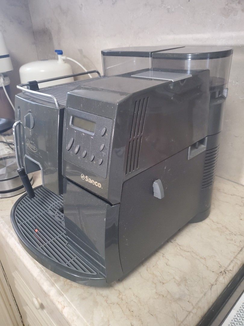 Saeco Royal Cappuccino Coffee Machine (Category: Coffee Machines & Makers) located in Paranaque City. Submitted by 247privateeye (Listing ID 1440305644, Image 2). Description: Used Saeco Royal Cappuccino coffee machine. Makes great espresso and cappuccinos. Has a built-in grinder and milk frother. Easy to use controls. Some signs of wear. Stored away. Powers on. No additional testing done. Being sold AS-IS. Pick up in Paranaque. .