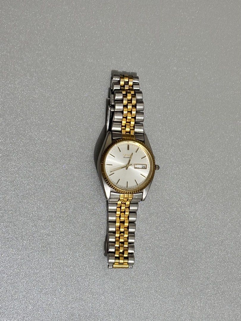 SEIKO 7N43 DAY DATE TWO TONE SILVER GOLD (Category: Luxury Watches) located in Manila. Submitted by primostuffs (Listing ID 1440368532, Image 2). Description: FOR SALE‼️‼️ SEIKO 7N43 DAY DATE TWO TONE SILVER GOLD - Brand: Seiko - Model: 7N43 Day-Date - Design: Two-tone (Silver and Gold) - Features: Day Date display and Jubilee bracelet.
