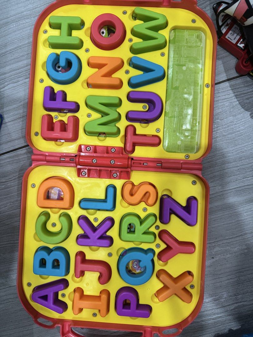 Sesame Street Elmo Alphabet Learning Case Toy (Category: Educational & Learning Toys) located in Quezon City. Submitted by aimee0913 (Listing ID 1440235325, Image 2). Description: - Interactive Elmo-themed case with Sesame Street alphabet. - Comes with colorful letter blocks that fit into the case. - Ideal for early learning and fun on the go. - Features a handle for easy carrying..