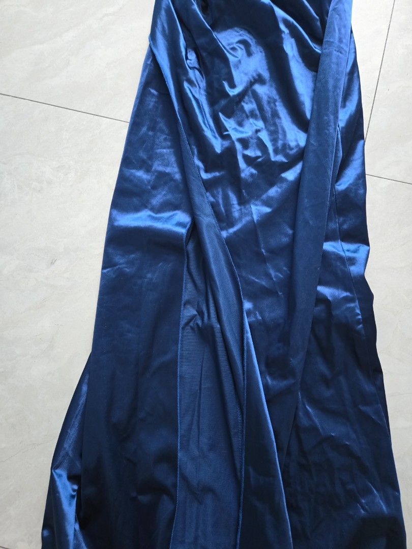 Shein Navy Blue Satin Long Gown (Category: Evening dresses & gowns) located in Pasig City. Submitted by izzy0202 (Listing ID 1440228860, Image 3). Description: - Elegant navy blue satin gown - Floor-length design - Shimmering satin fabric for a beautiful drape - Ideal for formal events, parties, and evening wear - Classic, versatile silhouette.