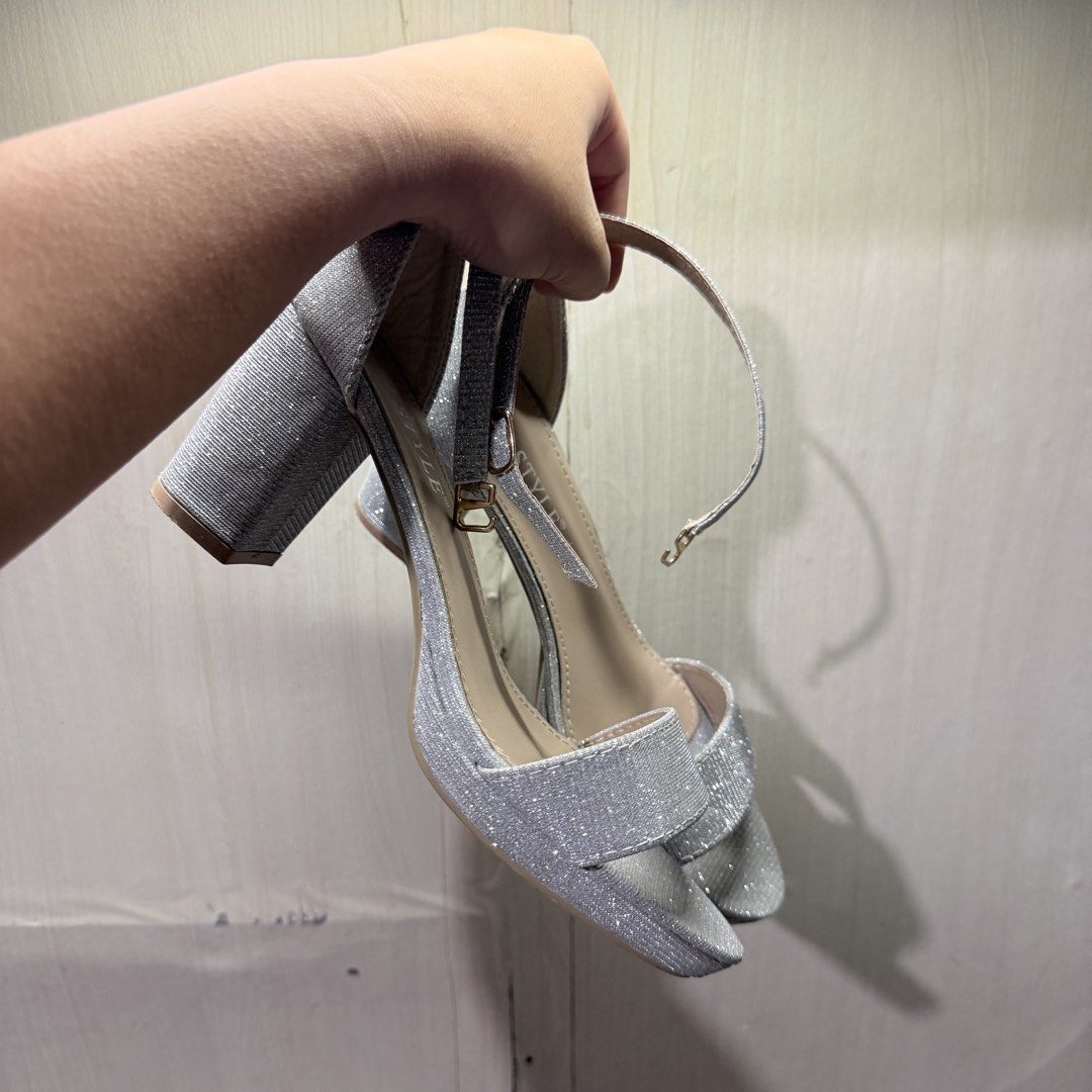 Silver Block Heels with Ankle Strap (Size 37) (Category: Heels) located in Tarlac. Submitted by milkshakeee_ (Listing ID 1440277500, Image 3). Description: - Used once only sa event - Bought at tiktok (Size 37) - silver glitter heels - Comfortable chunky block heel - Adjustable ankle strap with buckle closure - Platform sole for extra comfort - Perfect for parties and elevating any outfit - Size: 37.