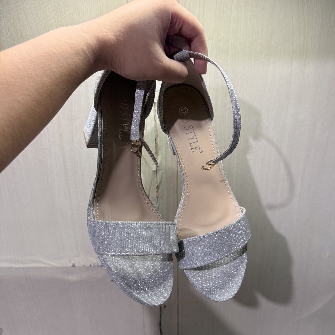 Silver Block Heels with Ankle Strap (Size 37) (Category: Heels) located in Tarlac. Submitted by milkshakeee_ (Listing ID 1440277500, Image 2). Description: - Used once only sa event - Bought at tiktok (Size 37) - silver glitter heels - Comfortable chunky block heel - Adjustable ankle strap with buckle closure - Platform sole for extra comfort - Perfect for parties and elevating any outfit - Size: 37.