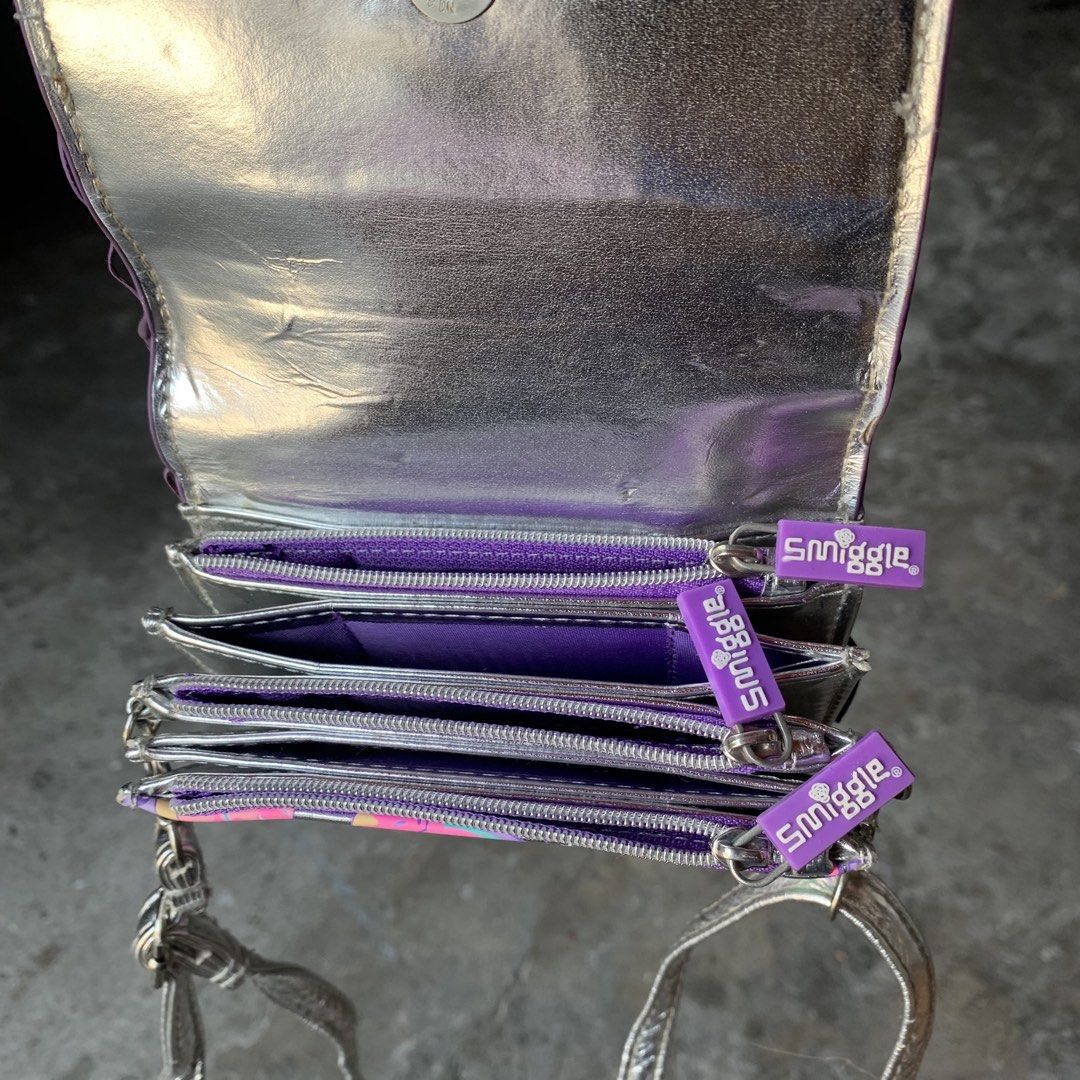 Smiggle purple sling bag wallet (Category: Babies & Kids Fashion) located in Manila. Submitted by tondo_todo (Listing ID 1440204990, Image 3). Description: DESCRIPTION- was not used. FLAWS- none CONDITION-9/10 (brandnew is 10/10) INCLUSION-will try to look for the box. LOC-Tondo Mnl MOP-Gcash, Lalamove cod/purchase COURIER-Flash, JnT, Lalamove and Grab Will leave the thorough review of the item to the buyer. Please double check. For used items, p