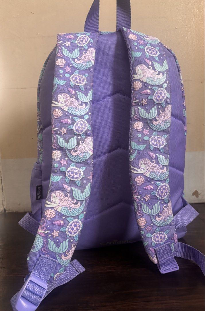 Smiggle Rush Classic Lite Backpack - Purple Mermaid (Category: Backpacks) located in Manila. Submitted by hotstuffmanila (Listing ID 1440253512, Image 2). Description: Smiggle Rush Classic Lite Backpack - Purple Mermaid design Originally bought for 3k++ Our Rush Classic Backpack is the ultimate staple for school, sports, travel and so much more! Features 3 zipped compartments to store a lunchbox, pencil case and tech, plus a drink bottle sleeve a