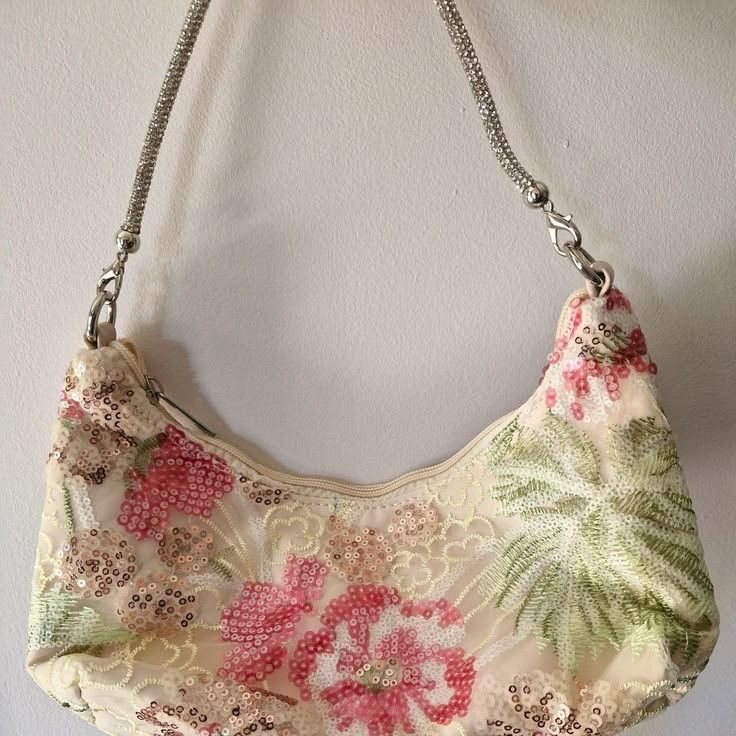 Sparkly Floral Shoulder Bag with Chain Strap (Category: Shoulder Bags) located in Panabo. Submitted by strewbardi (Listing ID 1440342859, Image 1). Description: - message for more detailed and actual pics -Cute shoulder bag with a beautiful floral design. - Covered in shimmering sequins and beads for a dazzling look. - Features a stylish silver chain strap. - Ideal for parties, nights out, or any special occasion. - Zipper closure keeps your belo