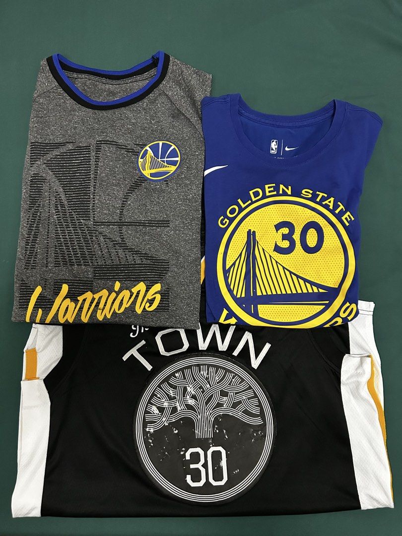 Steph Curry Bundle (Category: Sets & Coordinates) located in Quezon City. Submitted by bagsandstuffhub (Listing ID 1440307774, Image 1). Description: 1. TOWN JERSEY Medium in size 2. NIKE SHIRT Small in size 3. GRAY SHIRT Medium in size Decluttering COLOR MAY APPEAR DIFFERENT DUE TO LIGHTING.