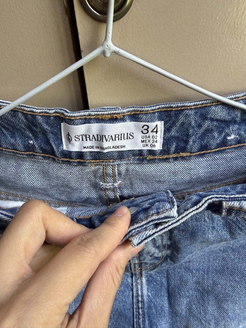 Stradivarius Blue Denim Mini Skirt Size 34 (Category: Skirts) located in Manila. Submitted by michikoy02 (Listing ID 1440344178, Image 2). Description: - Stradivarius blue denim mini skirt - Classic five-pocket style - Button and zip closure - Made in Bangladesh - Ideal for casual outfits - Versatile: easy to pair with tops and shoes.