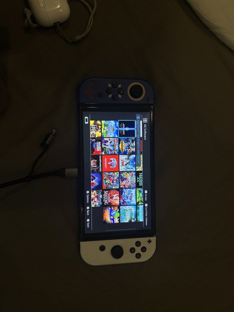Switch oled (Category: Nintendo) located in Singapore. Submitted by kaviyuu (Listing ID 1440273452, Image 1). Description: It comes with charger, 128gb micro sd card, 2x screen protector, extra joy cons.