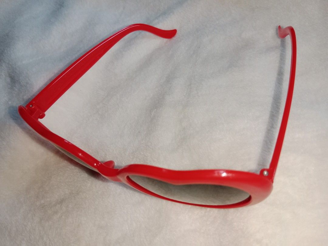Taylor Swift 22 Heart Shaped Sunglasses (Category: Sunglasses & Eyewear) located in Manila. Submitted by angeloarce64172 (Listing ID 1440378845, Image 2). Description: - Fun red heart-shaped sunglasses - Dark lenses for effective sun protection - Ideal for parties, festivals, or everyday fun - Lightweight and comfortable plastic frame - A playful accessory to elevate any outfit.