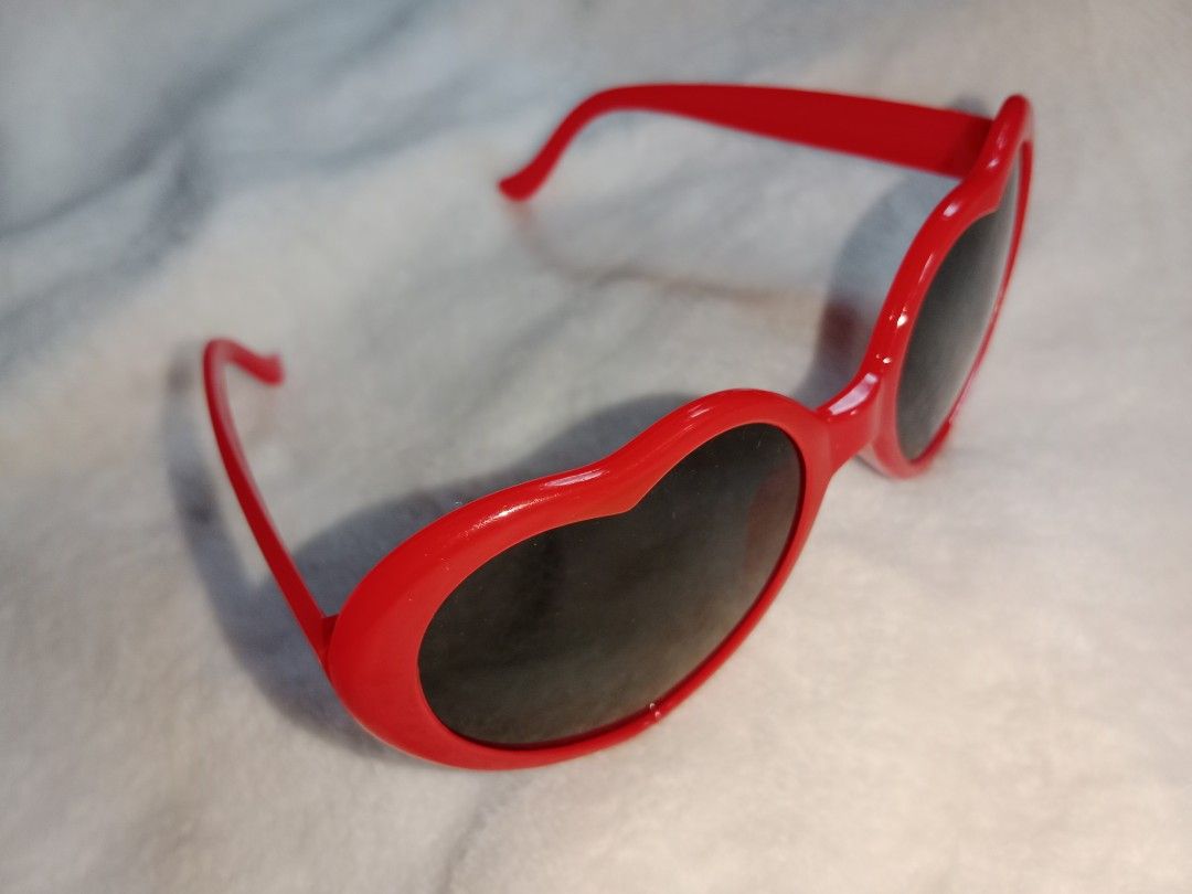 Taylor Swift 22 Heart Shaped Sunglasses (Category: Sunglasses & Eyewear) located in Manila. Submitted by angeloarce64172 (Listing ID 1440378845, Image 3). Description: - Fun red heart-shaped sunglasses - Dark lenses for effective sun protection - Ideal for parties, festivals, or everyday fun - Lightweight and comfortable plastic frame - A playful accessory to elevate any outfit.
