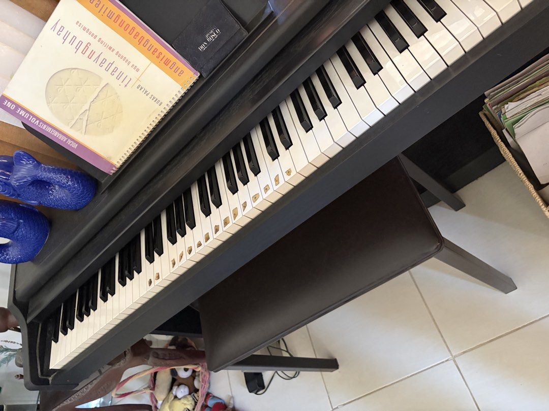 Technics Digital Piano with Bench (with defect) (Category: Musical Instruments) located in Muntinlupa City. Submitted by sungbora90 (Listing ID 1440223018, Image 2). Description: - Technics digital piano - Includes matching bench - Comes with several music books - Full set of keys and pedals - Ideal for aspiring pianists and practice - A wonderful addition for any music lover's home.