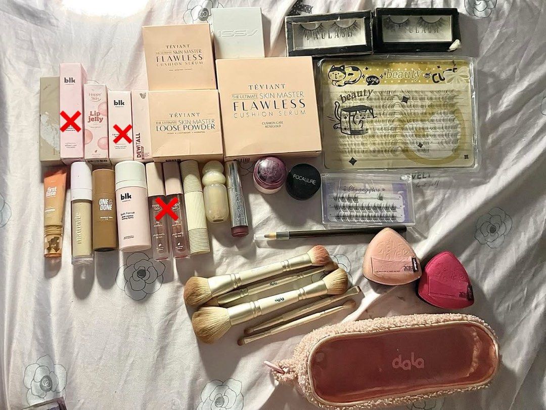 Teviant, blk, GRWM, Dorolab Makeup & Skincare Bundle (Category: Makeup) located in Manila. Submitted by cmikhaila (Listing ID 1440283257, Image 1). Description: - Discover a variety of makeup and skincare essentials. - Features Teviant cushion foundations and loose powder. - Includes blk lip jellies and tints for a pop of color. - Offers Dorolab individual lashes and other false lash options. - Comes with Nivea Soft cream tub for hydration. - Inc