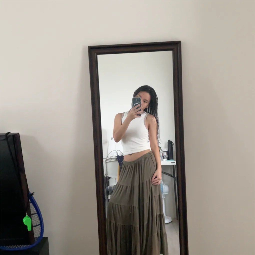 Tiered Maxi Skirt - Olive Green (Category: Skirts) located in Paranaque City. Submitted by fastdeer-1be458 (Listing ID 1440218765, Image 1). Description: - Flowy tiered maxi skirt - Versatile olive green color - Flattering high-waisted design - Multiple gathered tiers for a bohemian silhouette - Comfortable and relaxed fit - Ideal for casual outings or summer vibes.