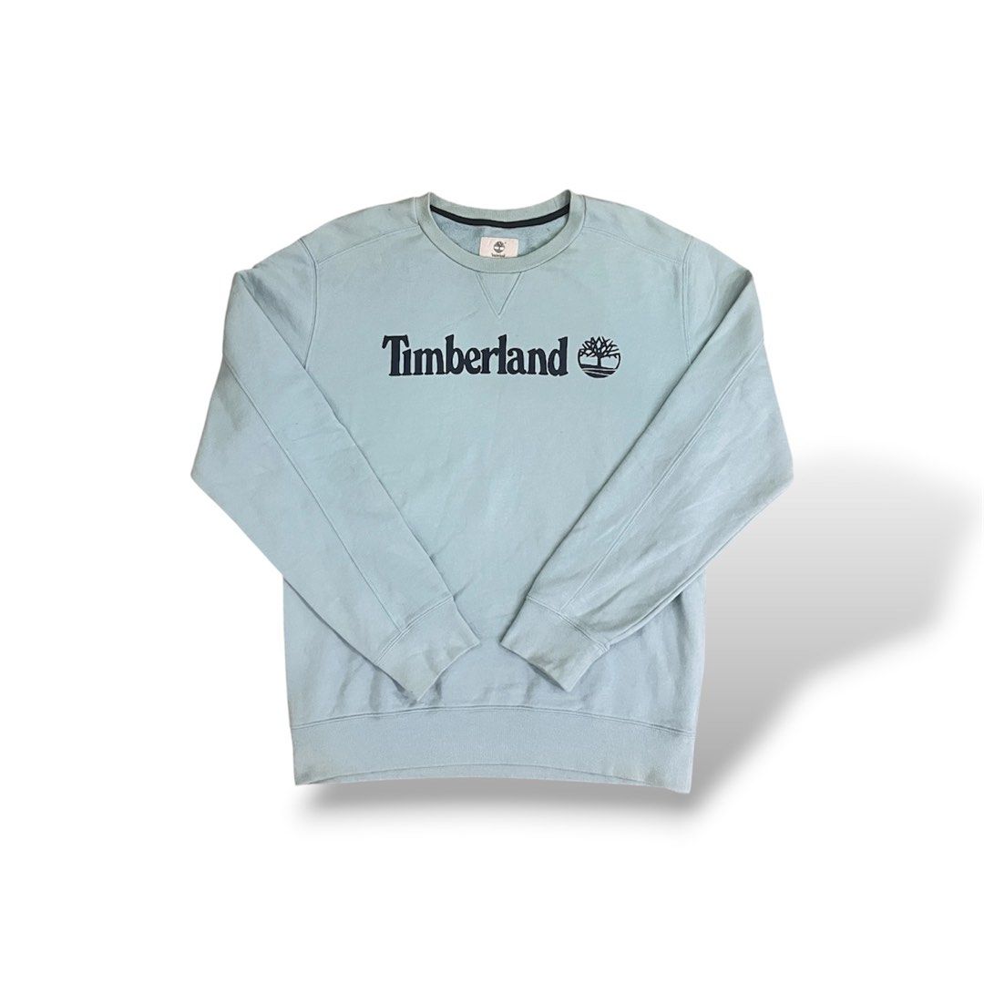 Timberland Crewneck Sweatshirt Light Blue (Category: Coats, Jackets and Outerwear) located in Manila. Submitted by jayril17 (Listing ID 1440207201, Image 1). Description: - Comfortable and stylish light blue Timberland crewneck sweatshirt. - Features the iconic Timberland logo printed on the chest. - Perfect for casual wear and layering. - A versatile addition to any wardrobe..