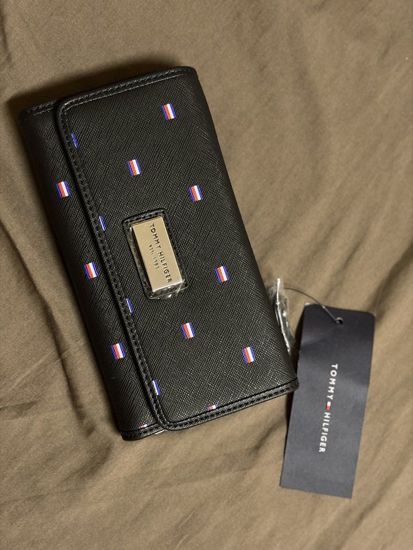 Tri-fold Tommy Hilfiger wallet with tag (Category: Wallets & Card holders) located in Paranaque City. Submitted by czarinamatias (Listing ID 1440339650, Image 2). Description: Brand new from US, with tag no box Price is negotiable.