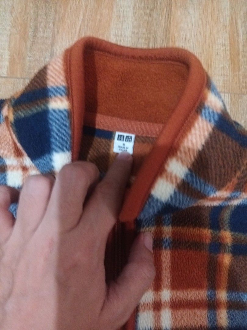 Uniqlo Plaid Fleece Full Zip Jacket (Category: Coats, Jackets and Outerwear) located in Paranaque City. Submitted by vanessa0214 (Listing ID 1440217577, Image 2). Description: - Cozy Uniqlo fleece jacket - Classic plaid pattern (brown, blue, white) - Full-zip closure - Stand-up collar for extra warmth - Perfect for layering in cooler weather - Comfortable and stylish for everyday wear.