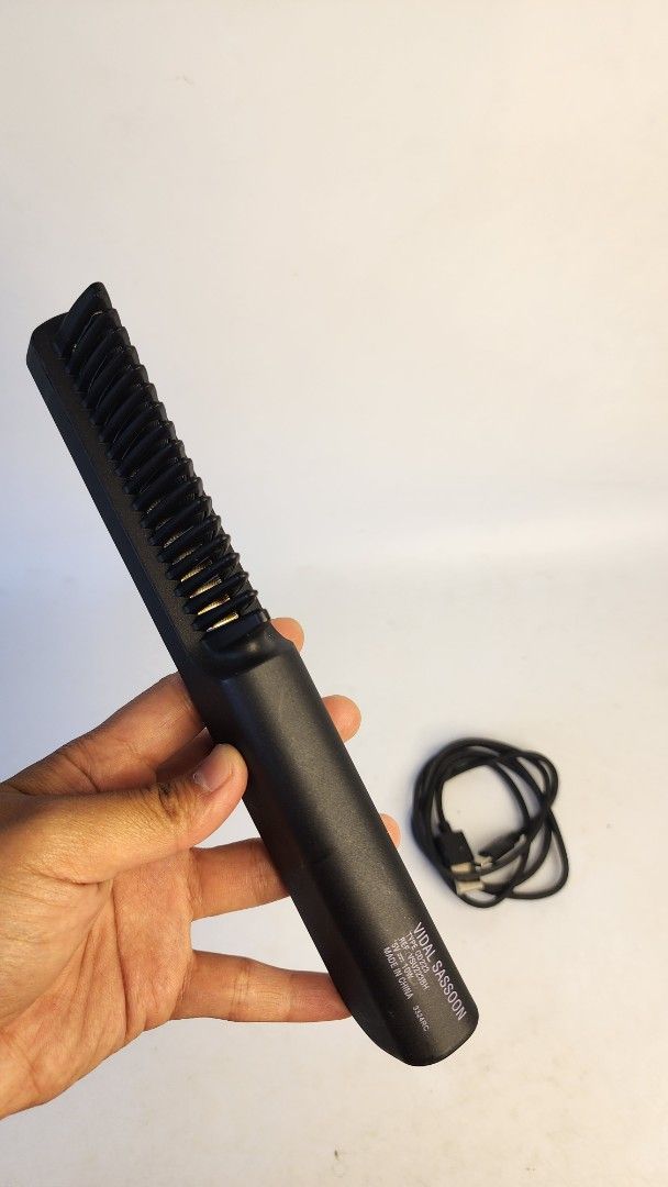 Vidal Sassoon Heated Comb Straightener with USB Cable (Category: Hair) located in Baguio. Submitted by chiechie1234 (Listing ID 1440263727, Image 3). Description: - Heated comb for effortless hair straightening - Sleek black color - Includes USB charging cable for convenience - Features a small display screen and three intuitive buttons - Compact and portable design, perfect for travel or quick touch-ups - Get smooth, sleek hair anytime, anywhere