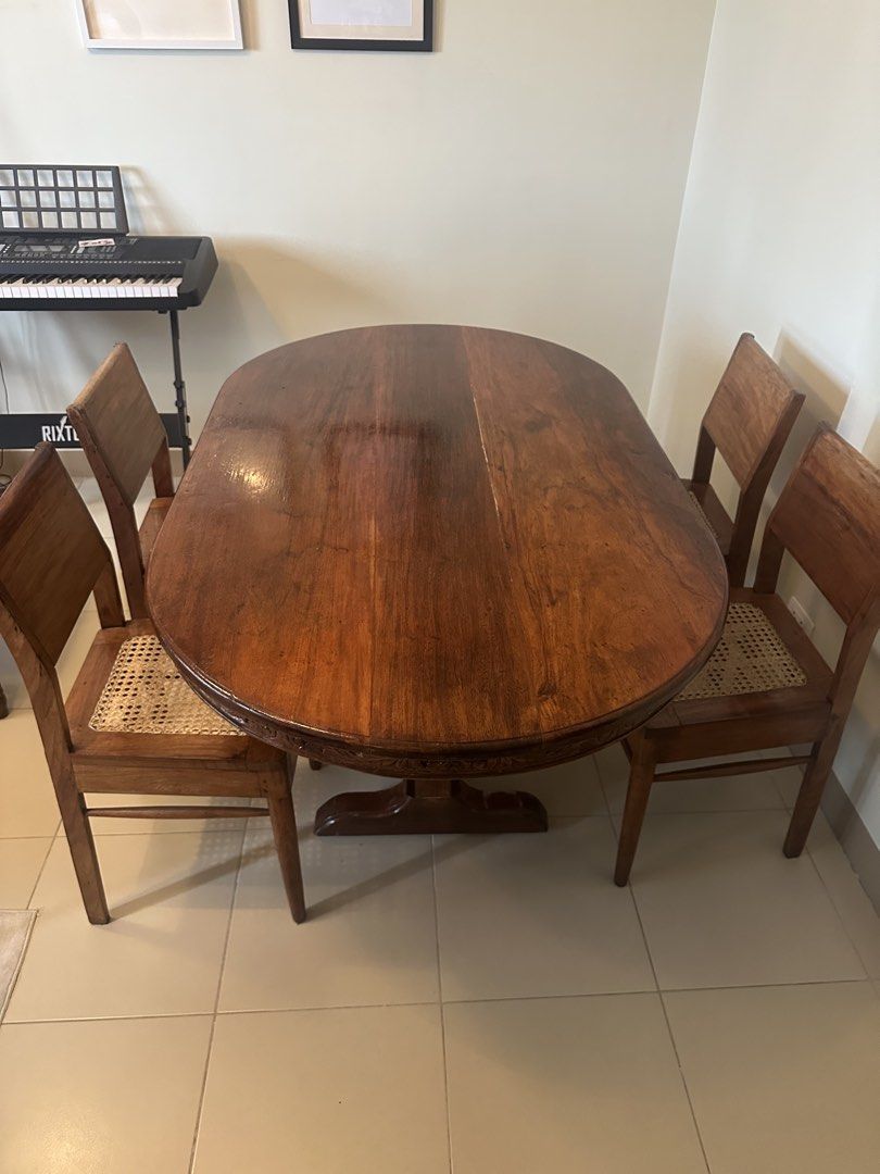 Vintage Solid Wood Dining Set (Category: Tables & Sets) located in Quezon City. Submitted by abetano (Listing ID 1440261610, Image 1). Description: Vintage solid wood dining set in very good condition - Solid wood oval dining table - 4 solid wood/rattan chairs - Sold as a complete set RFS: Moving out.