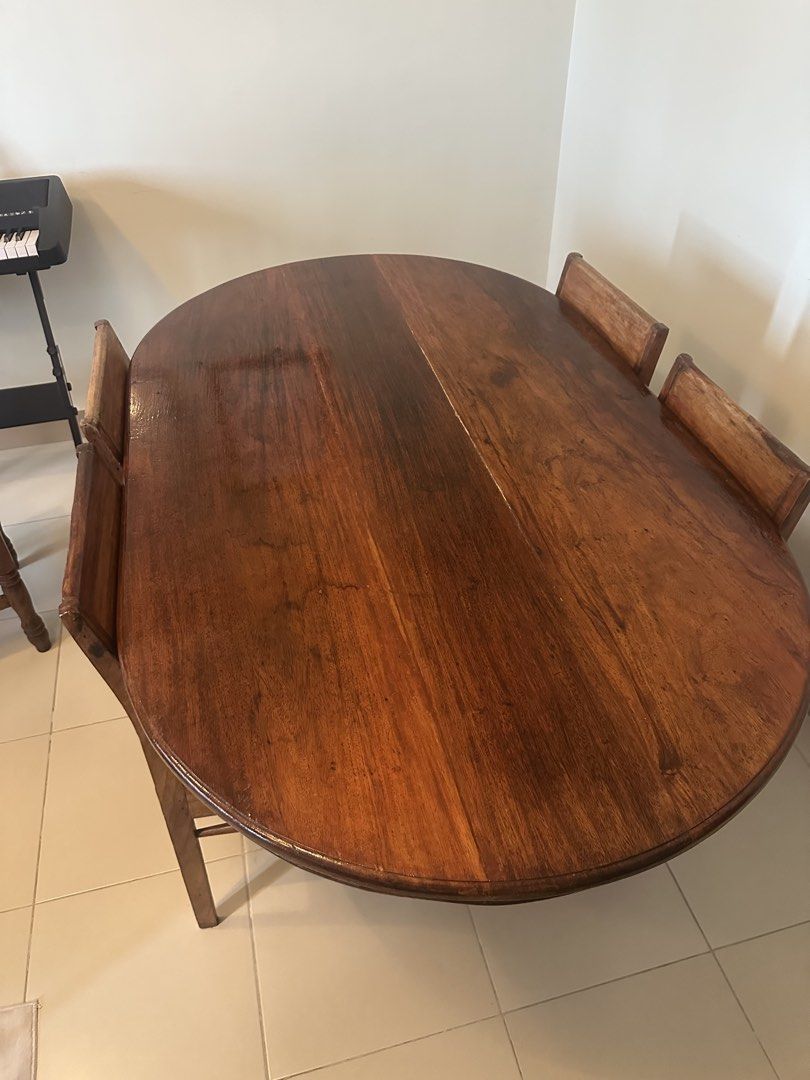 Vintage Solid Wood Dining Set (Category: Tables & Sets) located in Quezon City. Submitted by abetano (Listing ID 1440261610, Image 3). Description: Vintage solid wood dining set in very good condition - Solid wood oval dining table - 4 solid wood/rattan chairs - Sold as a complete set RFS: Moving out.