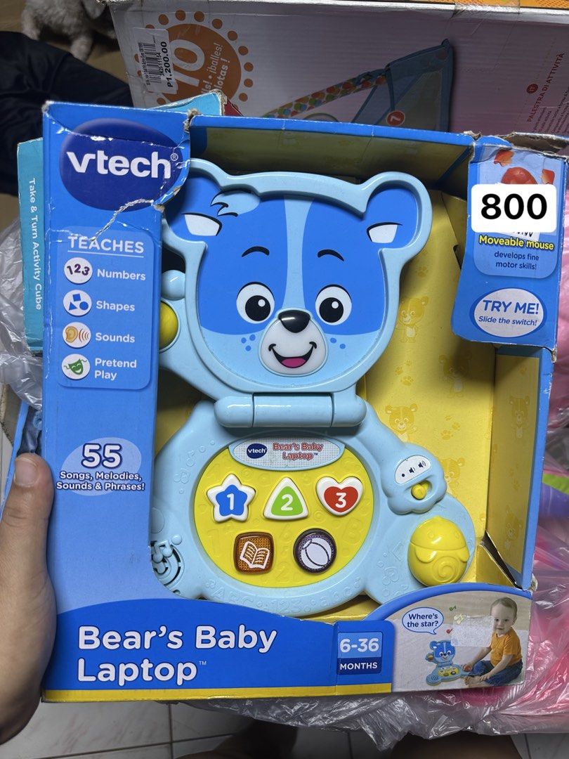 VTech Bear's Baby Laptop Toy (Category: Educational & Learning Toys) located in Manila. Submitted by airacruz0048042 (Listing ID 1440357197, Image 1). Description: - VTech Bear's Baby Laptop - Teaches numbers, shapes, sounds, and pretend play - Features 55 songs, melodies, sounds, and phrases - Includes a moveable mouse to develop fine motor skills - Recommended for ages 6-36 months - Ideal for early learning and interactive play.