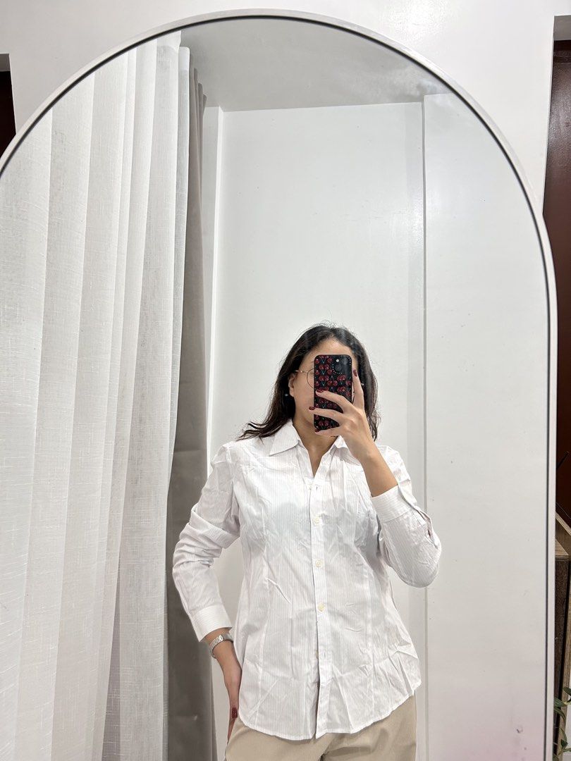 White Button-Up Shirt with Subtle Stripes (Category: Longsleeves) located in Caloocan City. Submitted by avryph (Listing ID 1440366673, Image 1). Description: - Classic white button-up shirt - Features subtle vertical stripes for texture - Long sleeves with button cuffs - Sharp, clean look - Versatile for work or casual wear - Easy to pair with any outfit.