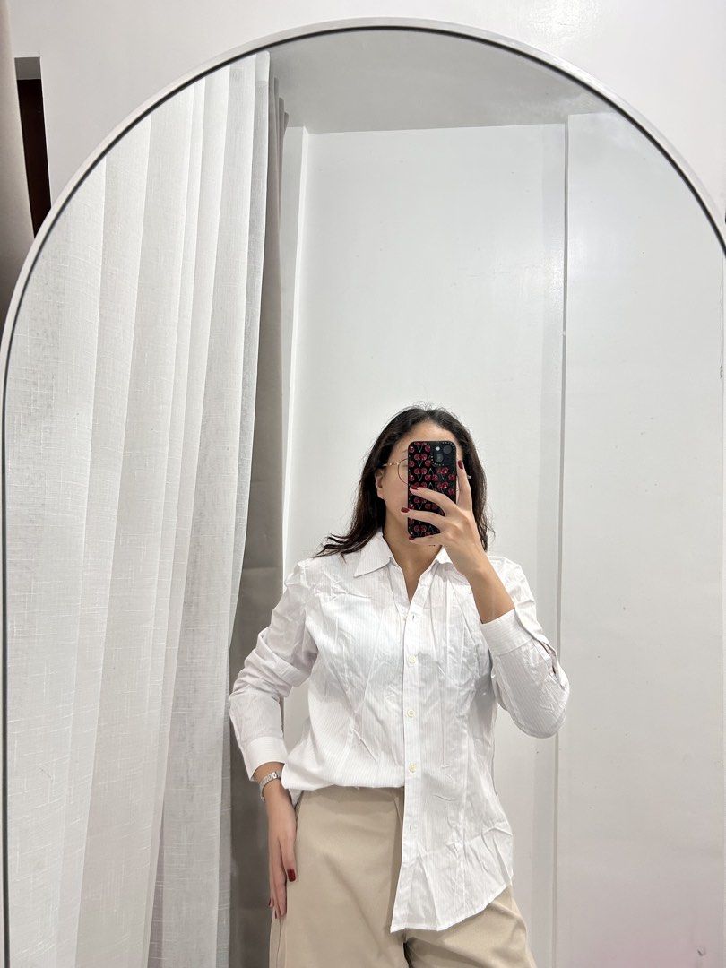 White Button-Up Shirt with Subtle Stripes (Category: Longsleeves) located in Caloocan City. Submitted by avryph (Listing ID 1440366673, Image 2). Description: - Classic white button-up shirt - Features subtle vertical stripes for texture - Long sleeves with button cuffs - Sharp, clean look - Versatile for work or casual wear - Easy to pair with any outfit.
