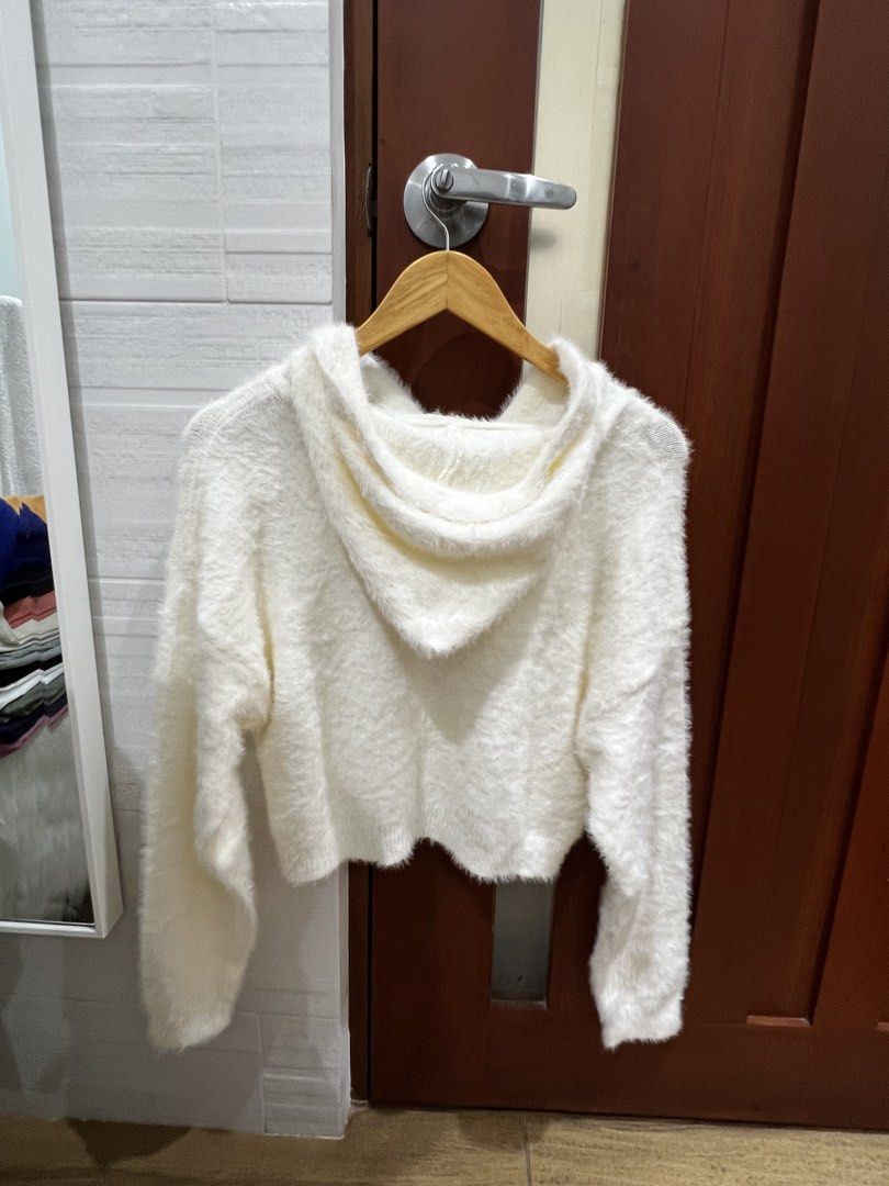White Fuzzy Cropped Hoodie (Category: Coats, Jackets and Outerwear) located in Manila. Submitted by thejenclai01765 (Listing ID 1440360335, Image 2). Description: - Super soft and cozy white cropped hoodie - Features a fuzzy texture all over - Drawstring hood for adjustable comfort - Ideal for layering or wearing solo - Looks and feels warm and comfortable - Perfect for chilly days.